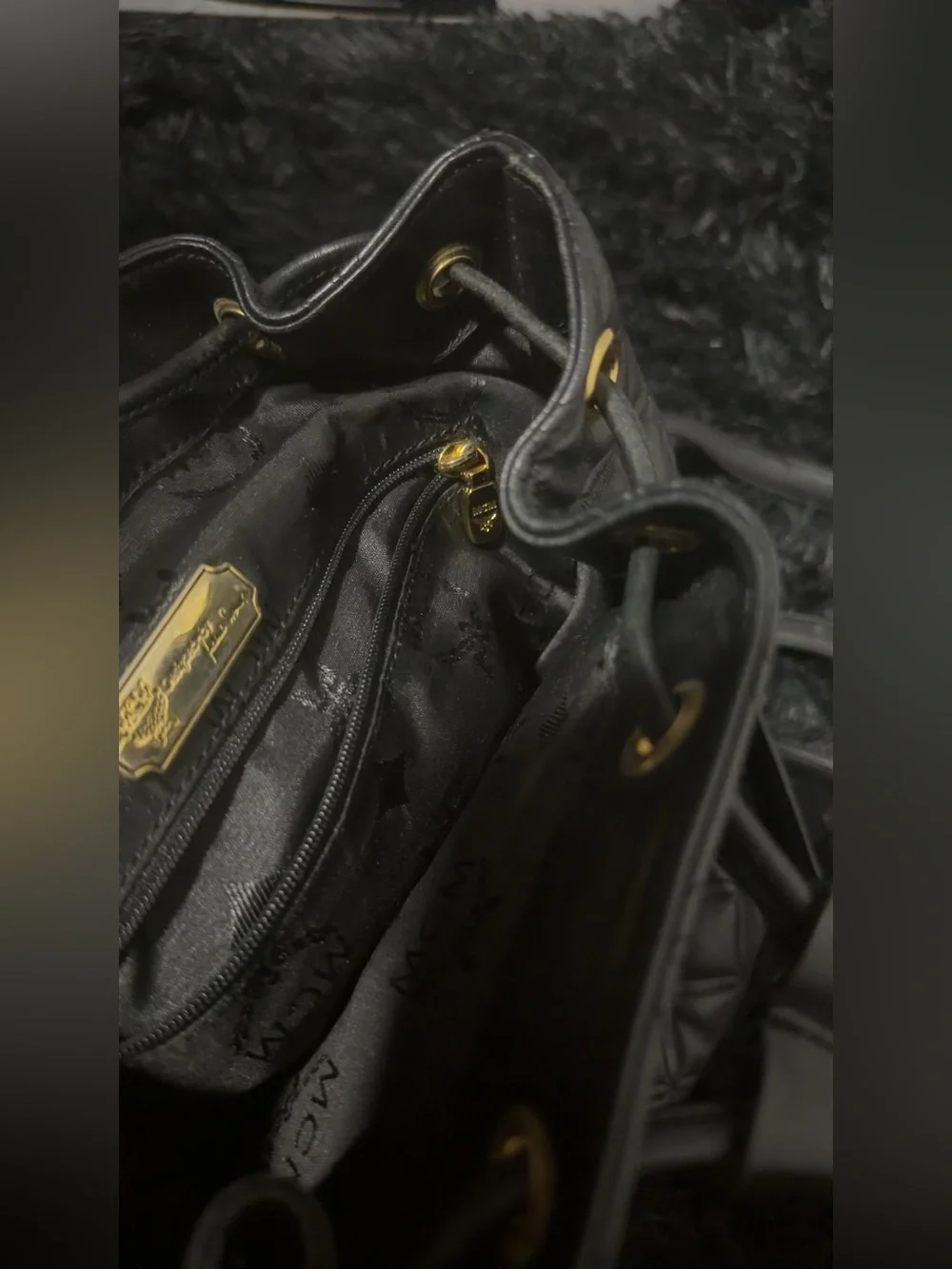 MCM Black Quilted Leather Backpack with Gold Hardware Accents